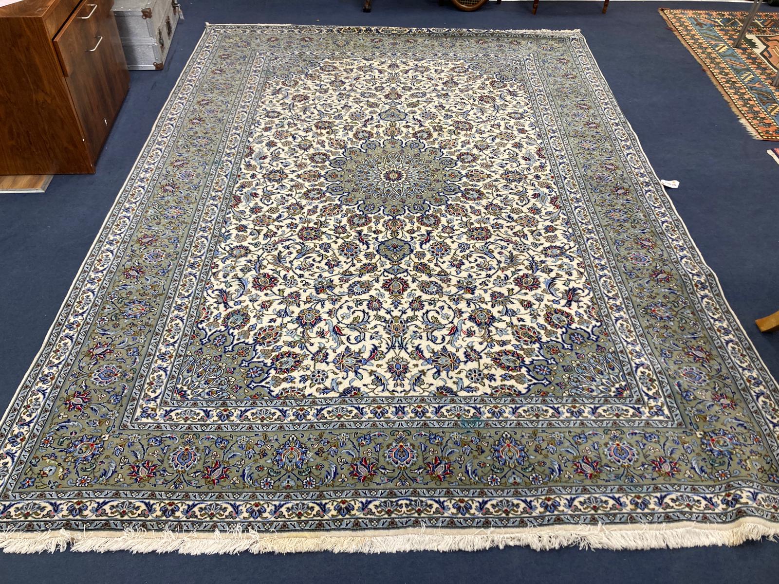 A North West Persian ivory ground carpet, 350 x 250cm